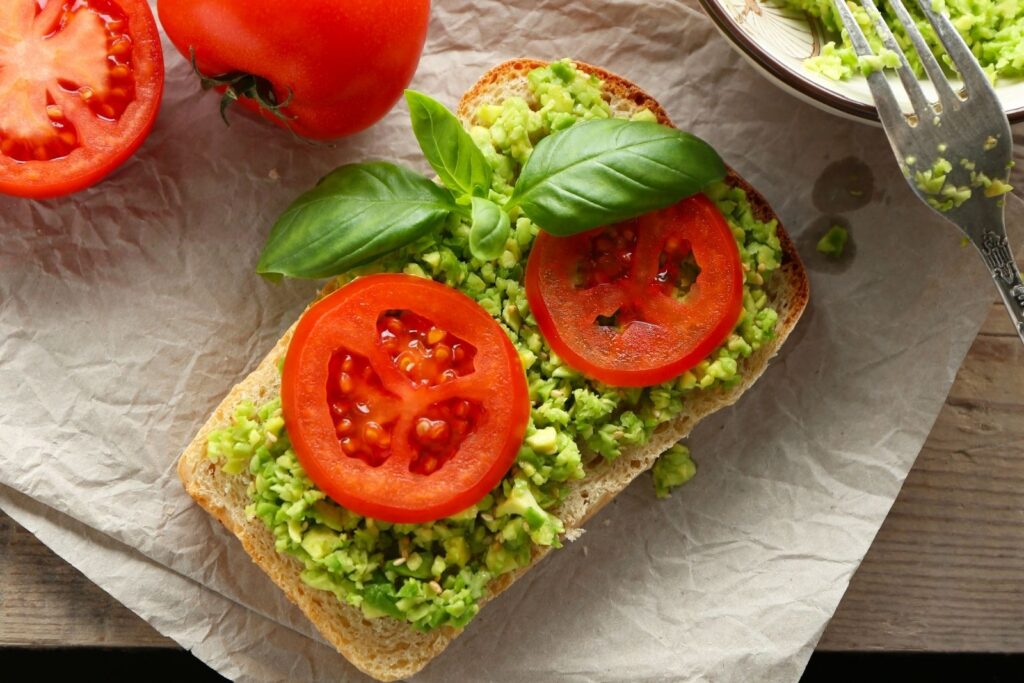Avocado and tomato sandwich on bread