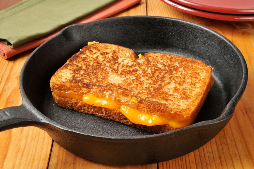 Golden grilled cheese sandwich with melted cheese