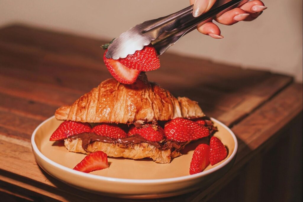 Nutella and strawberry sandwich on bread